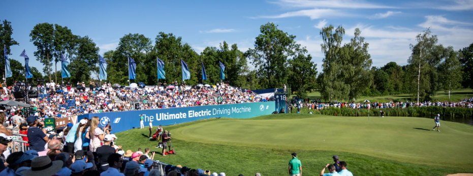 photo of golfers on a green surrounded by spectators at the BMW International Open Golf Tournament